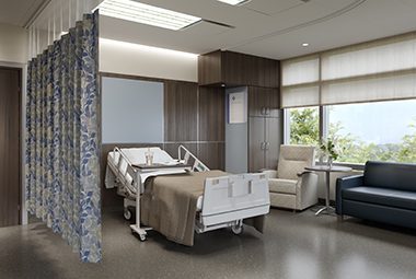 A hospital patient room with cubical curtains and window treatments is shown here.