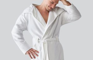 Male model wearing hotel robe by Heidi Weisel