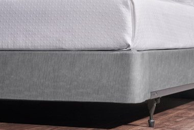 image of Encircle, a box-spring cover, being shown on a bed.