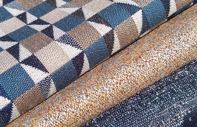 This is an image of Sunbrella Outdoor Fabric. Fabrics shown are Zion in Bluestone, Westwood in Bronze and Chimera in Meteorite.