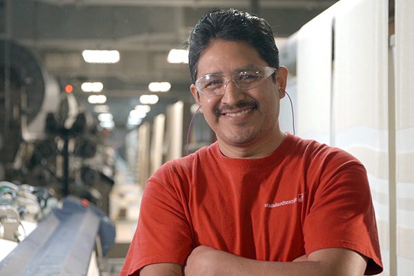 Image of the smiling hispanic associate in our Thomaston, GA. It is a great place to work if you're looking for manufacturing jobs in Georgia.
