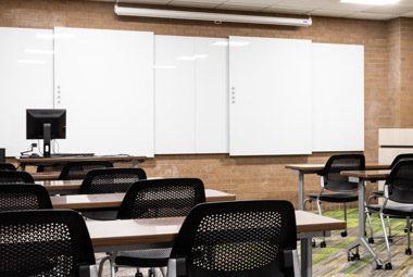 Image of a classroom with multiple Clarus white boards