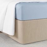 Circa Bed Wrap shown in Rice Paper, a light beige.