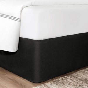 Corner of a bed featuring the Circa Bed Wrap Ready-to-Ship Fabric in Black.