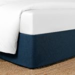 CIrca Bed Wrap shown in Sea, a dark blue.