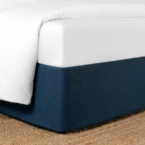Corner of a bed featuring the Circa Bed Wrap Ready-to-Ship Fabric in Sea.