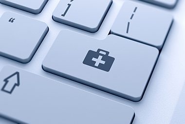 healthcare icon imposed on a keyboard