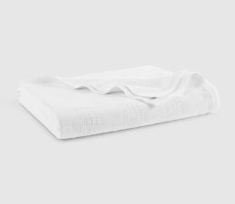 The Elite hospital blanket in white is shown here folded.