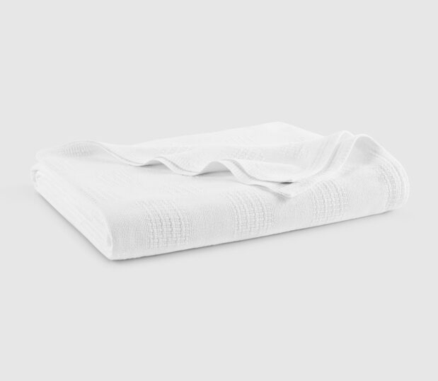 The Elite hospital blanket in white is shown here folded.