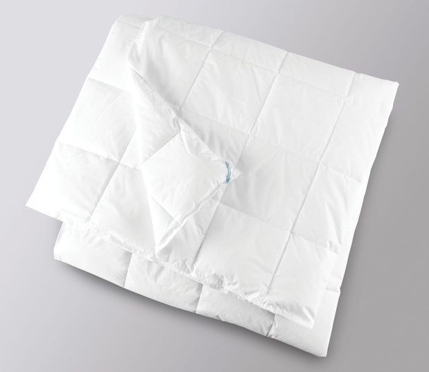 Shown here is a white folded AirLux, hypoallergenic duvet  insert.