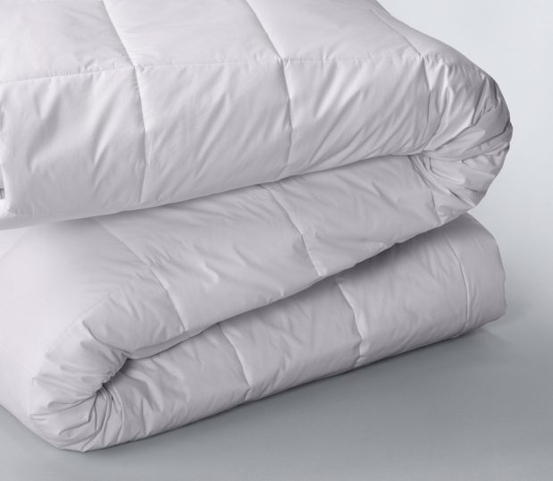 This is an image of a folded white Innerloft duvet insert. It is the perfect weight for a summer duvet.