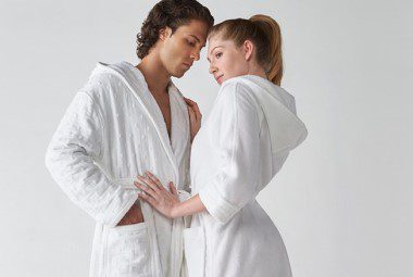 A man and a women in luxurious bath robes