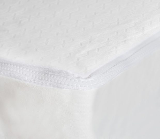 Corner detail of AllerEase Gold Mattress Encasement. This mattress encasement protects against bed bugs, dust mites, allergens, spills, and microbes.