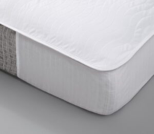 A corner detail of a Waterproof mattress pad, EuroTech, shown on a mattress.