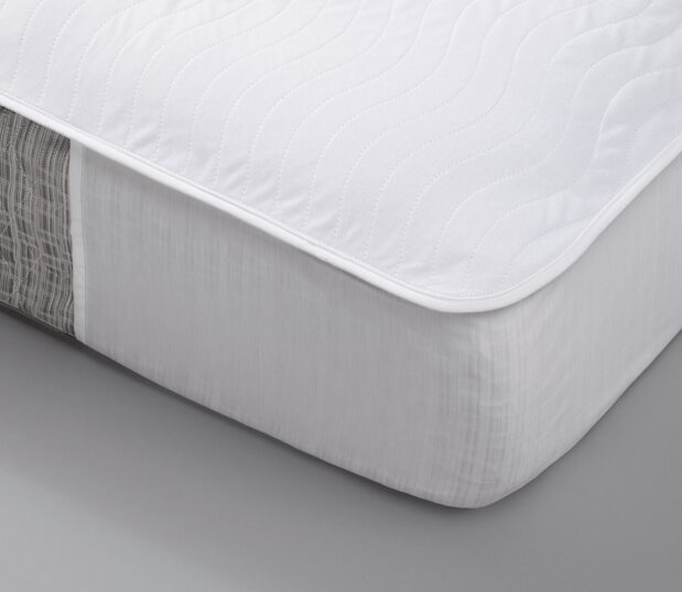 A corner detail of a Waterproof mattress pad, EuroTech, shown on a mattress.