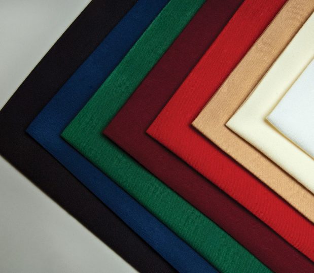 Multi-color stack of Avila professional napkins laid out in a geometric pattern.