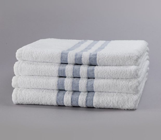 A stack of 4 hospital towels with a 3-Stripe design are pre-laundered, eliminating the need for up-front processing.