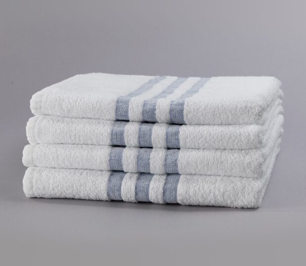 A stack of 4 hospital towels with a 3-Stripe design are pre-laundered, eliminating the need for up-front processing.