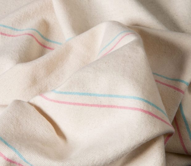 Detail of a pink and blue baby blanket.