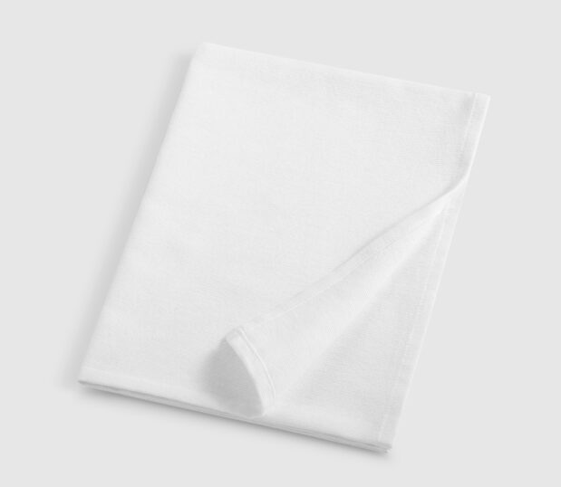 Super Daydream White Baby Blanket shown folded here. This baby blanket features a napped, cotton-rich fabric that feels soft to the touch.