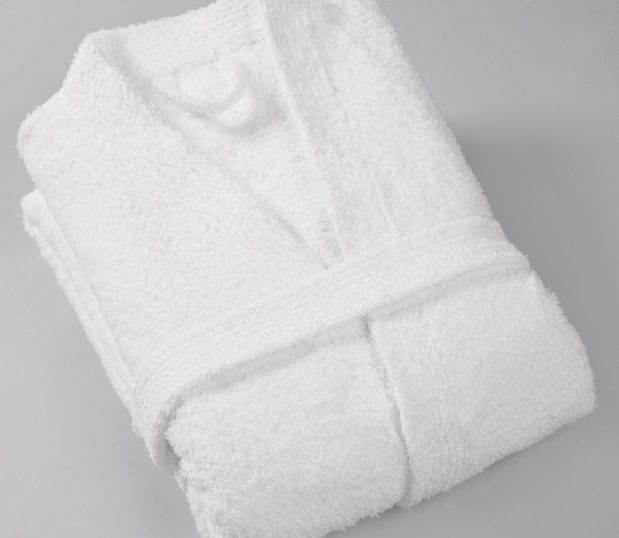 photo of a folded 100% cotton robe on a grey background.