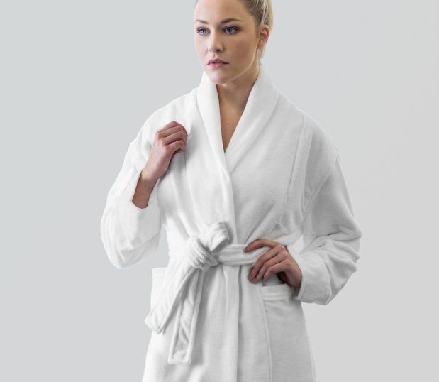 Logan Bathrobe by Heidi Weisel robes. This is a white unisex bathrobe shown on a pretty female model.