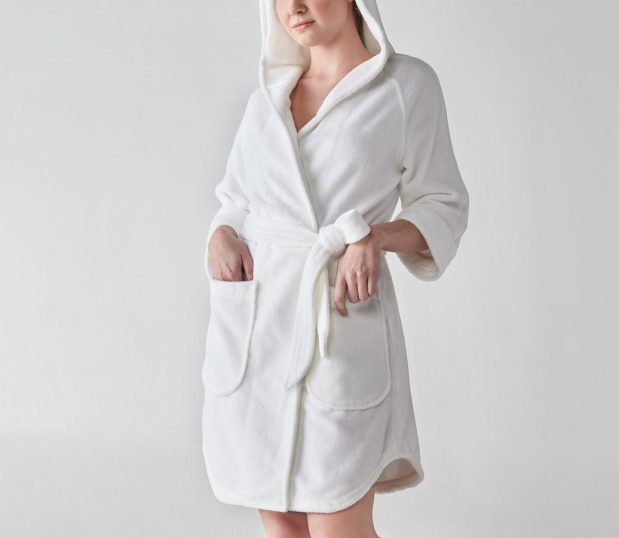 Heidi Weisel robes are designed to fit, flatter, and make women feel special. This view shows the shirt-tail hem and the hood being worn by the model.