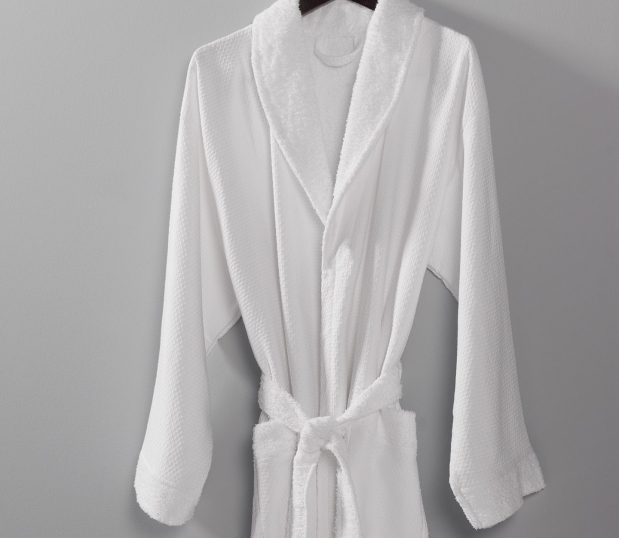 Image of a one of the cotton hotel robes Standard Textile carries. It is unique for it honeycomb pattern and soft terry interior.