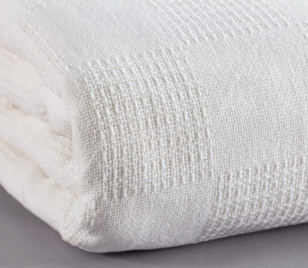 This photo is a detail of the 100% Cotton Thermal Blanket with a Checkerboard Pattern.