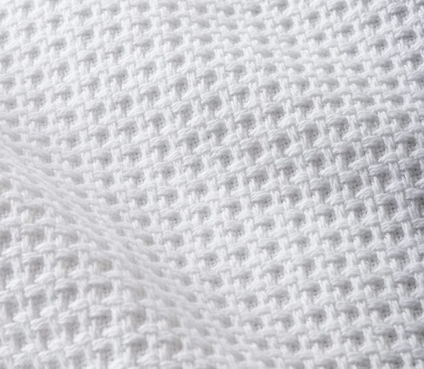 Detail of a the detail of Lynova cotton waffle blanket. Made of 100% Cotton, this cotton blanket will keep you warm and comfortable.