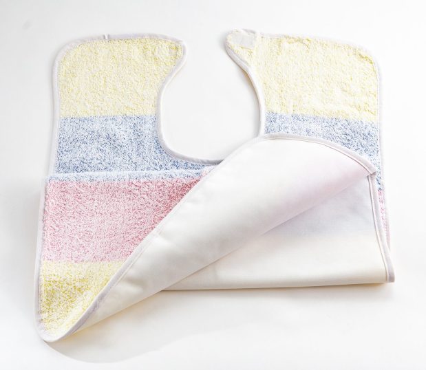 The Vinyl Barrier Clothing Protector has wide pastel stripes. This adult bib features soft 100% cotton combined with vinyl barrier protection.