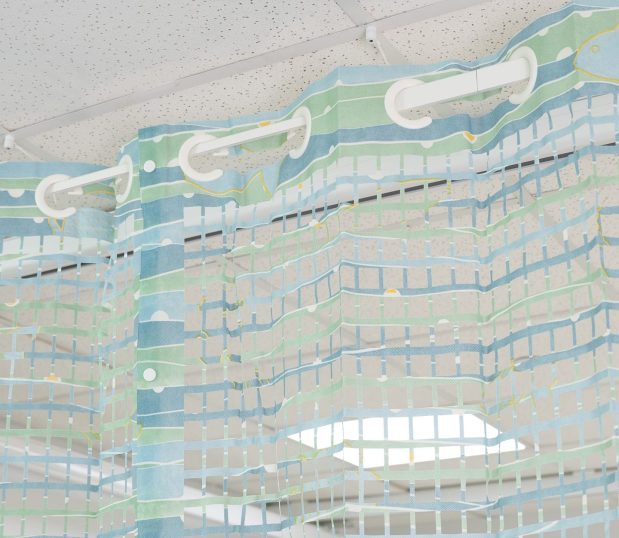 Detail of On the Right Track Disposable Privacy Curtains' integrated mesh. The pattern is called Landscape.