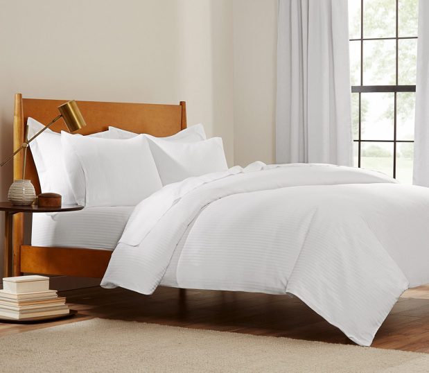 This subtly striped duvet cover delivers hotel quality comfort and durability. A ComforTwill® duvet cover will stay bright and soft, wash after wash. Shown here: a ComforTwill duvet bed setting.