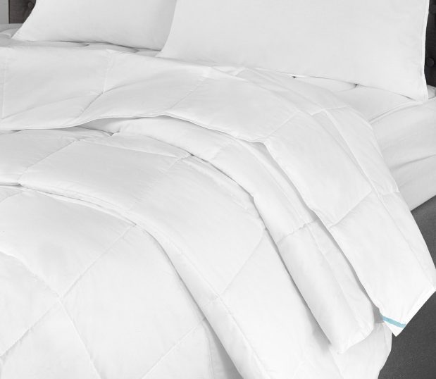 Innerloft® all seasons duvet insert will keep your guests the perfect amount of cozy all year long. Shown here: a duvet insert on a bed.