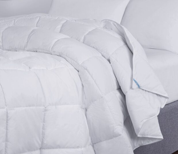 This heavyweight, oversized comforter provides guests with the ultimate in luxury comfort. Shown here: a plush duvet insert on a bed.