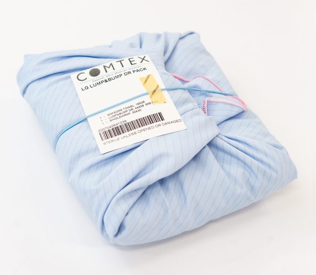 Image of folded Lump and Bump Drape in blue with pin striping. These drapes are reusable and can be used for a variety of procedures.