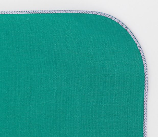 Detail image of the Barrier Supreme Surgical Wrapper in Jade. The merrowed edge of the surgical wrapper indicates its size.