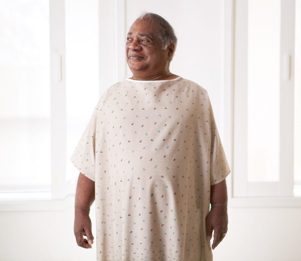 Image of a patient wearing our Bariatric Double Lapover Patient Gown. These bariatric hospital gowns include options for I.V. Sleeves, Telemetry Pockets, Raglan Sleeves, Set-in Sleeves, and Double Waist Ties.