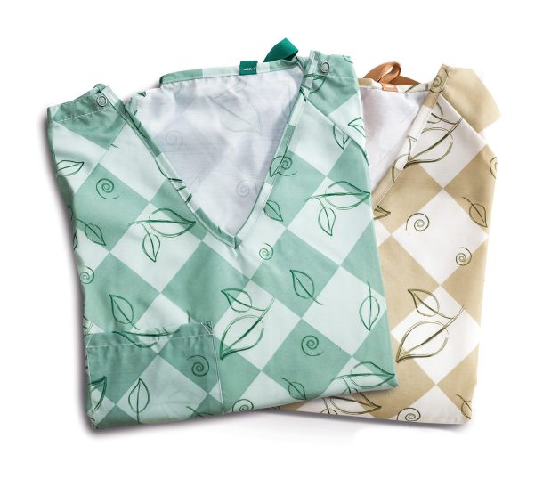 Stack of two of our E*Star® Double Lapover Patient Gowns. Both color options Leaves Pine and Leaves Sand are shown.
