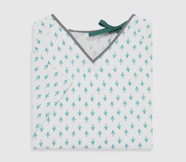 Folded double lapover patient gown in Embassy Teal. This hospital gown features tape ties at the neck and waist.