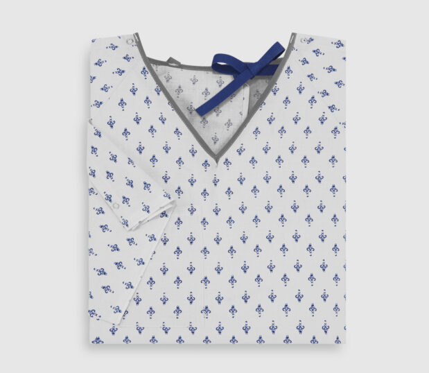 Folded double lapover patient gown in Embassy Navy. This hospital gown features IV sleeves and telemetry pocket.