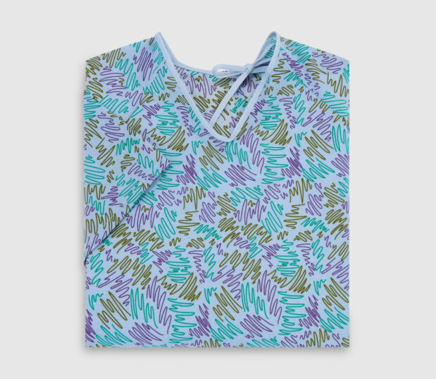 Folded EStar patient gown in Gala Blue. This gown features a lapover design.