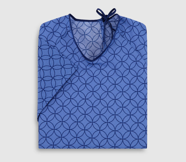 Folded EStar patient gown in Motif Blue. It is lapover design.