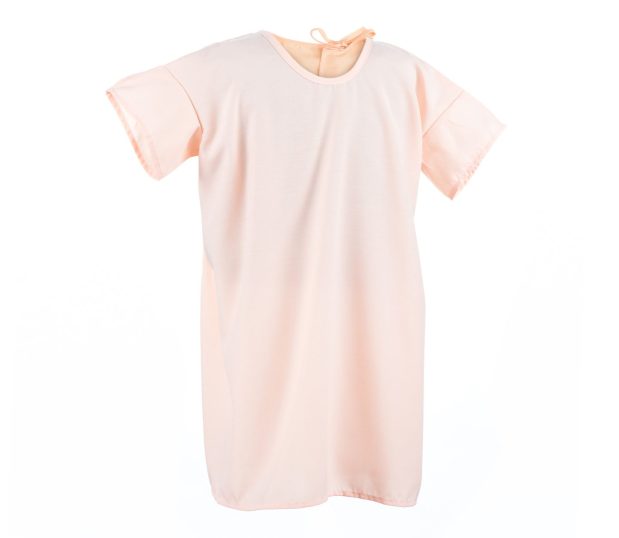 This silhouette of a lapover style pediatric hospital gown in a solid coral.