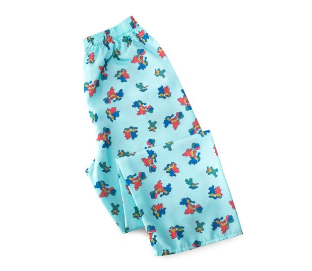 Pediatric Pajama Pants Children’s Healthcare Apparel folded shown in the Happy Hound pattern in the color Aqua.