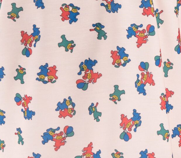 Pediatric Pajama Pant fabric swatch in Happy Hound in the color Coral.