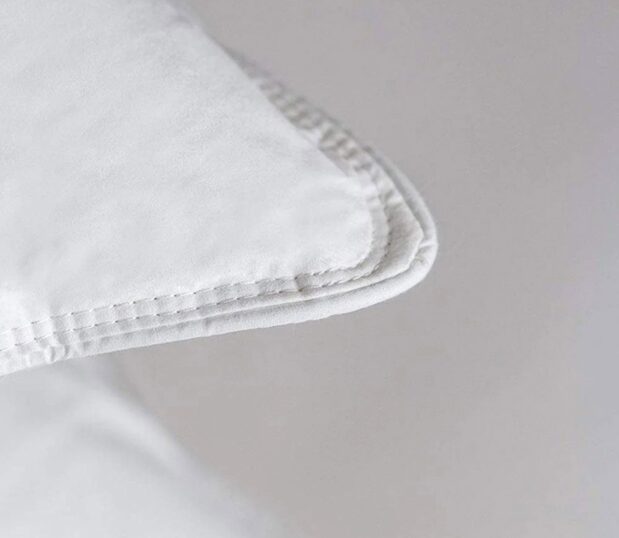 A detailed image of the corner stitch of chamber pillows.