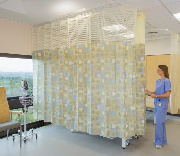 Custom Privacy Curtain shown in a hospital room with a nurse.