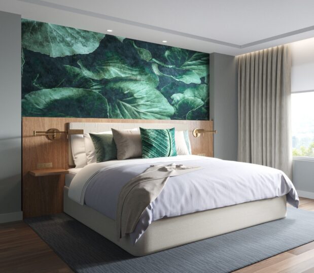 Custom wallcovering of enlargement of green leaves behind bed with coordination ImagePoint pillows.