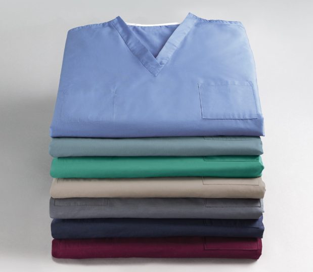 Stack of our Standard Classic Unisex Scrub Shirt. These scrub shirts are fully reversible with a left chest pocket on both sides.